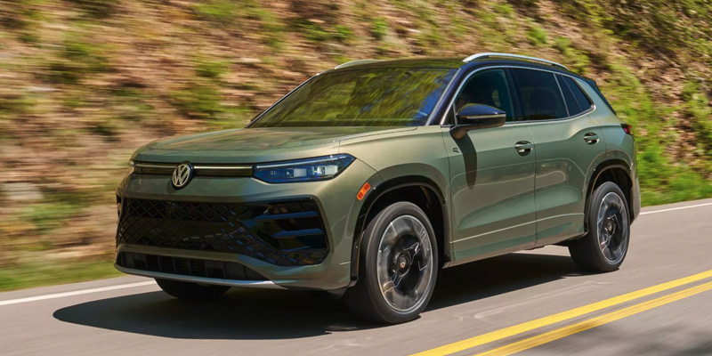 A 2026 Volkswagen Tiguan rushing down the road in Rogers, AR 