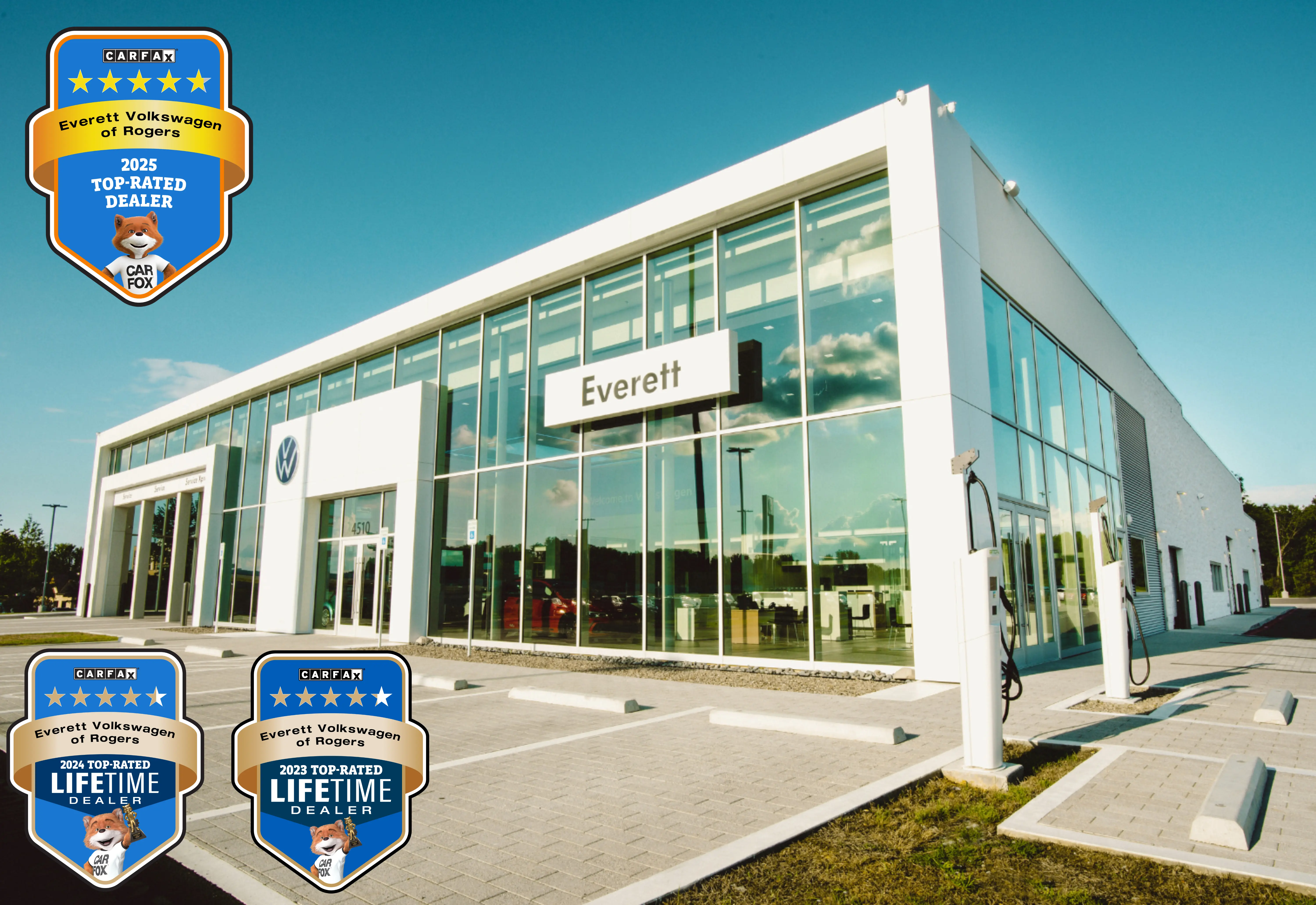 Everett Volkswagen showroom exterior with Carfax Top-Rated Dealership awards displayed